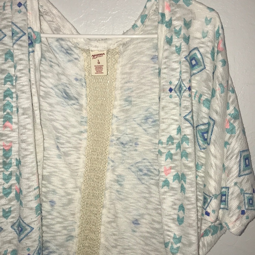 Whiter cardigan with blue and pink Aztec designs